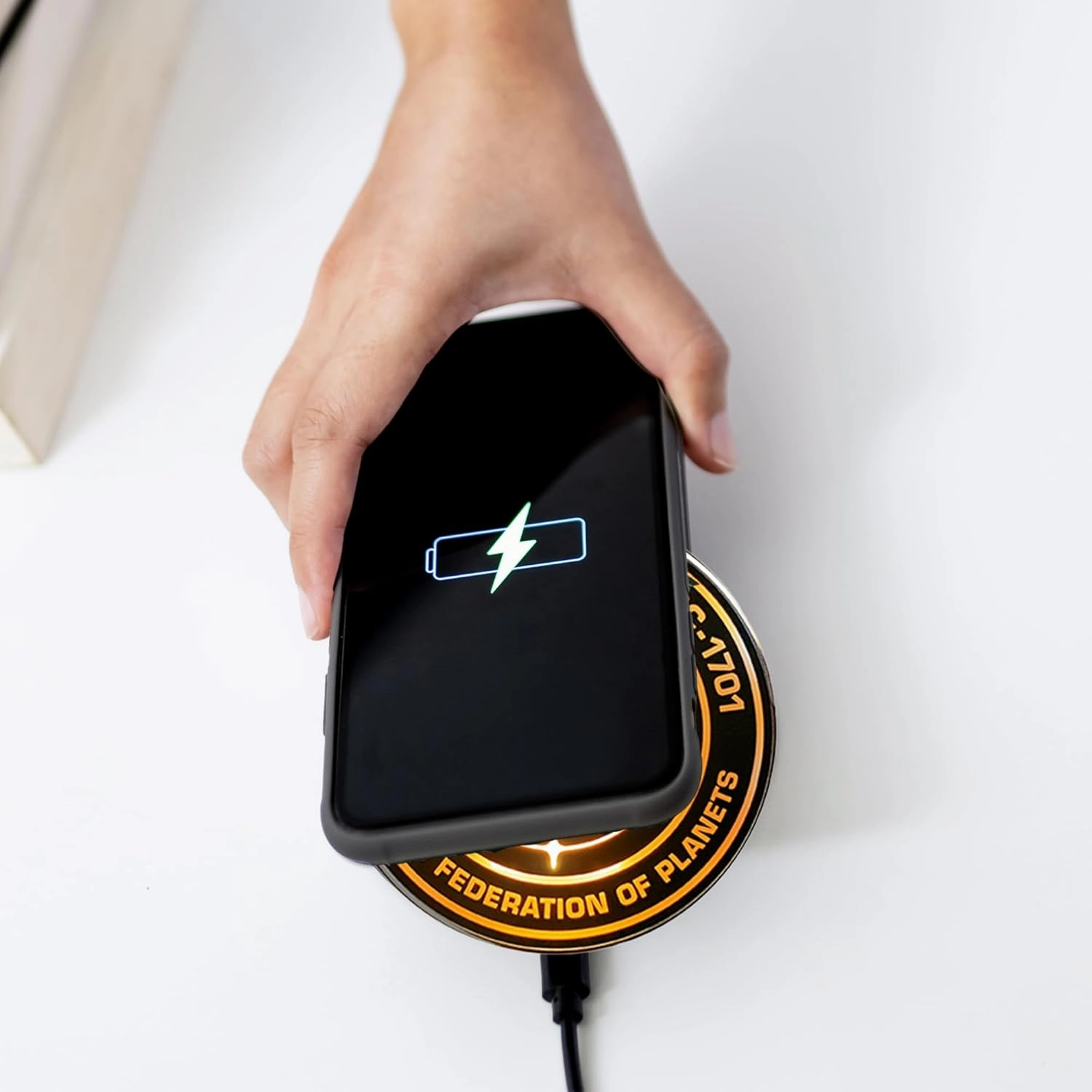 Star Trek Strange New Worlds Illuminating Wireless Charger with Built-in Backup Battery Pack for Wired and Wireless Charging. Portable Phone Charger with Orange Enterprise Emblem Light-Up Logo